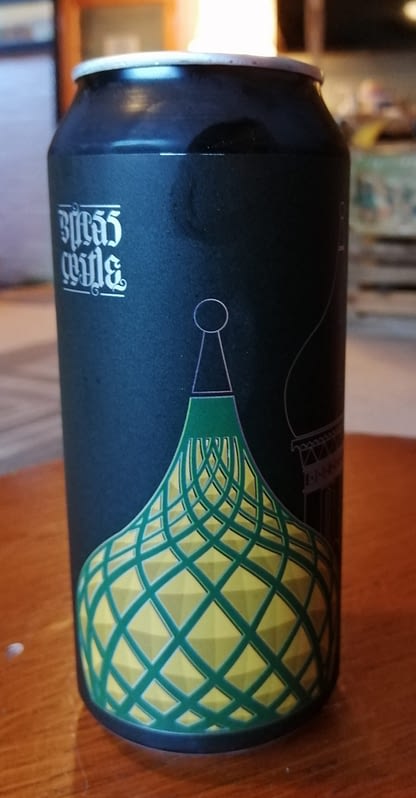 Tall black can with illustration of domes